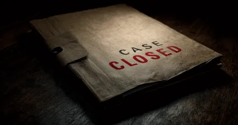 A weathered case file stamped with "CASE CLOSED" in red, symbolizing a failed council investigation into a dog attack.